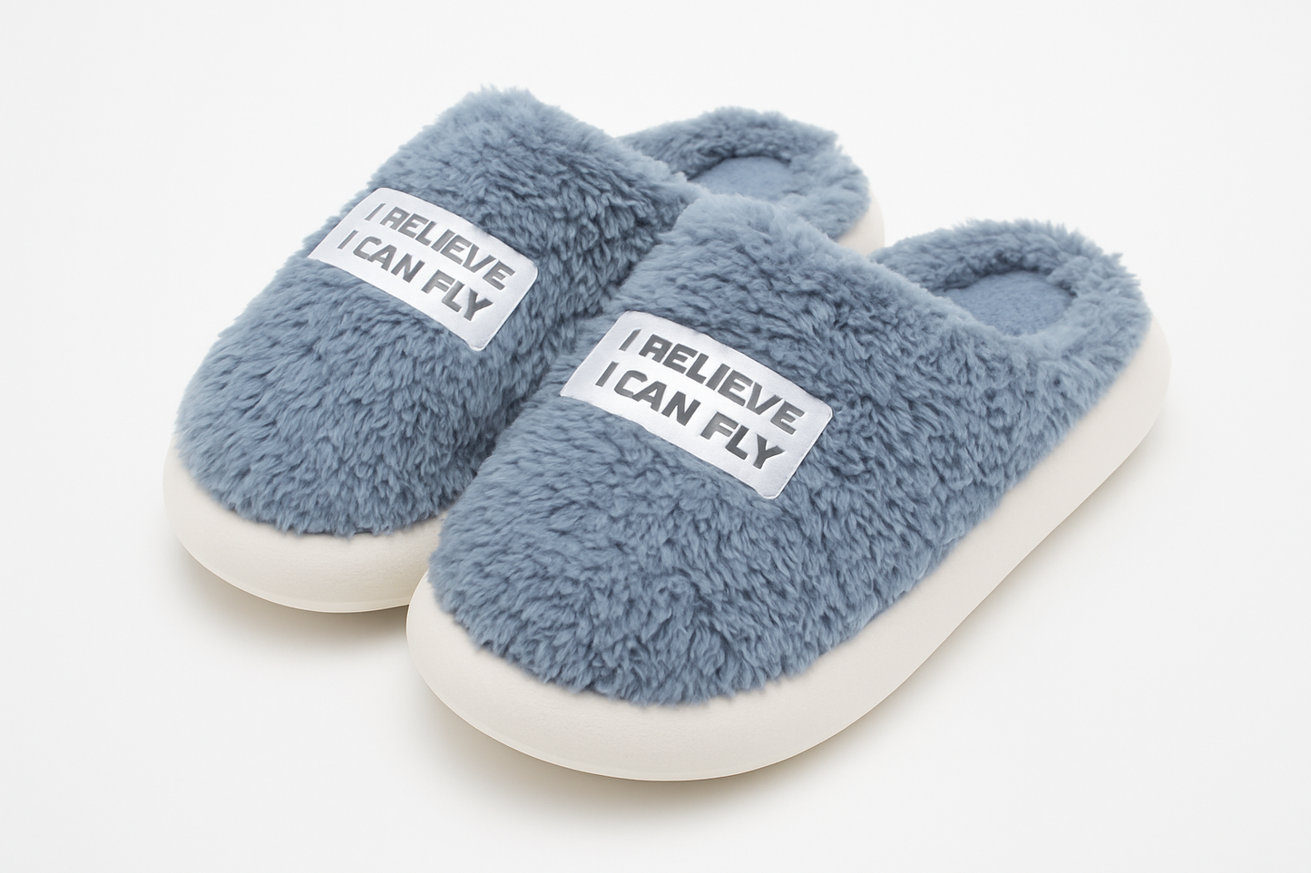 Professional product photo of gray fuzzy slippers with motivational text
