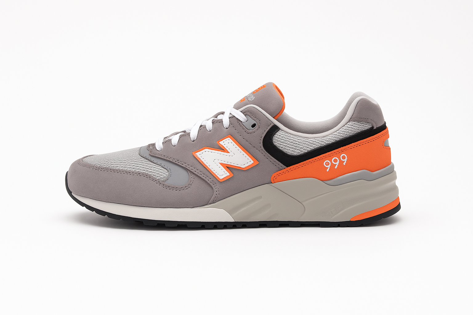 Gray and orange New Balance sneakers with clean background