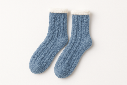 Professional product photo of blue fuzzy socks