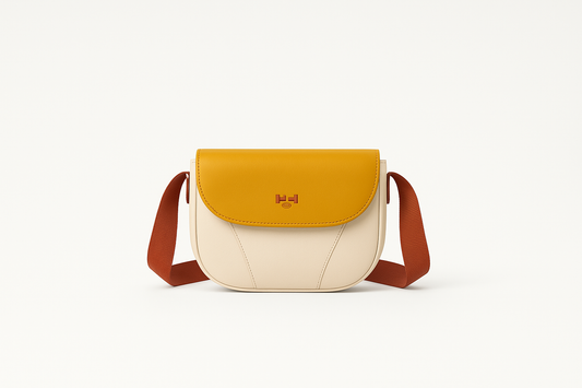 Professional product photo of cream and yellow crossbody bag